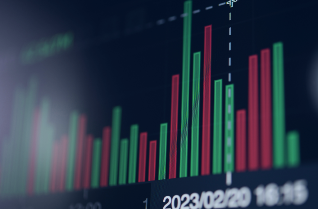 Wykres giełdy z czerwonymi i zielonymi słupkami.